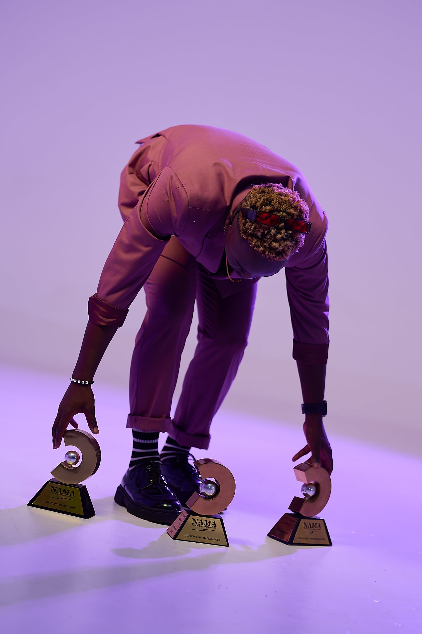 Tichaona "Hero" Chikara with NAMA National Arts Merit Award trophies